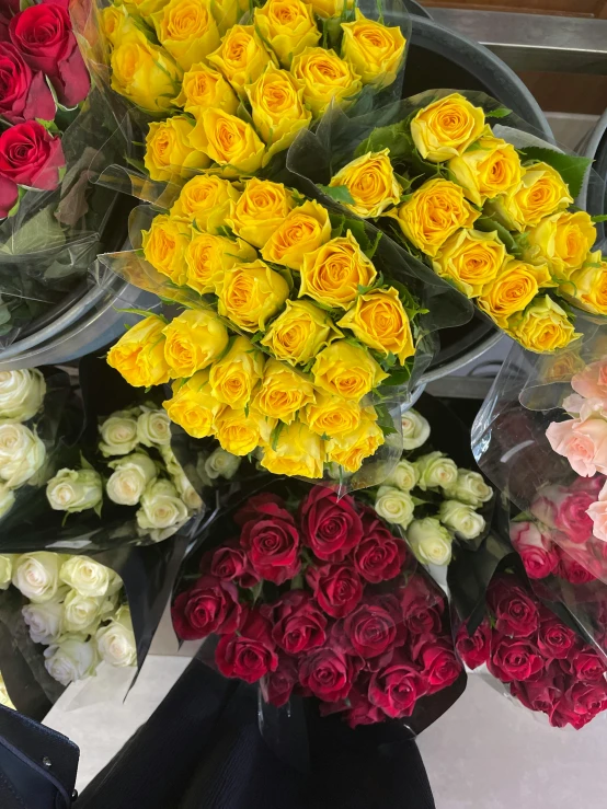 there are different flowers that are on the counter