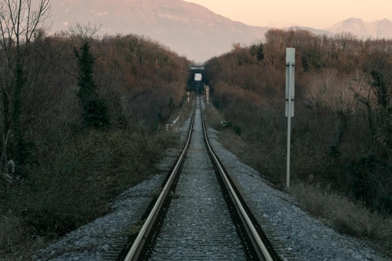 the view from a train as it passes through a grassy valley