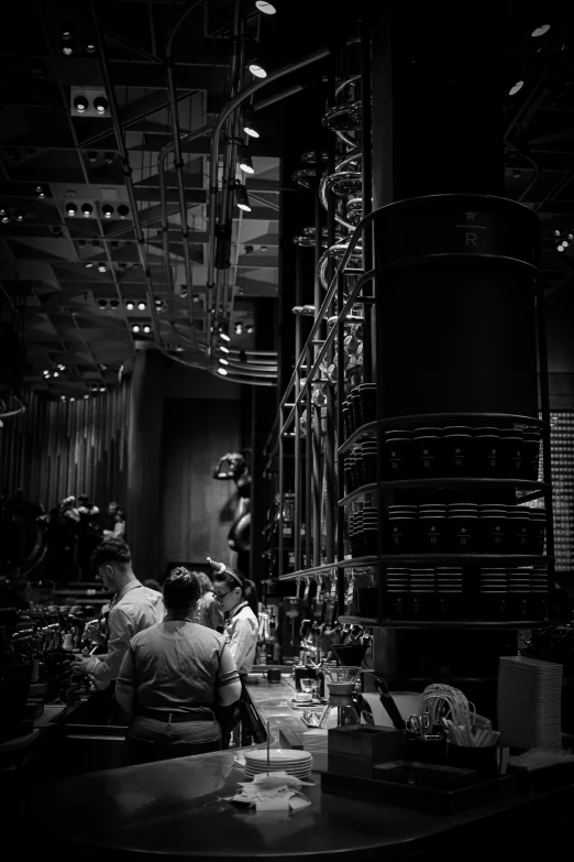 black and white pograph of a group of people sitting at a table