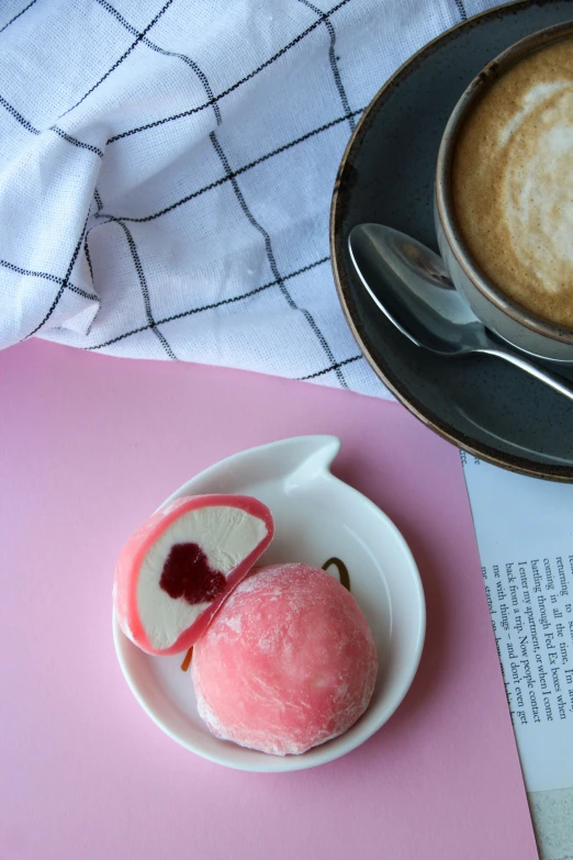 a dessert on a plate with two serving spoons next to it