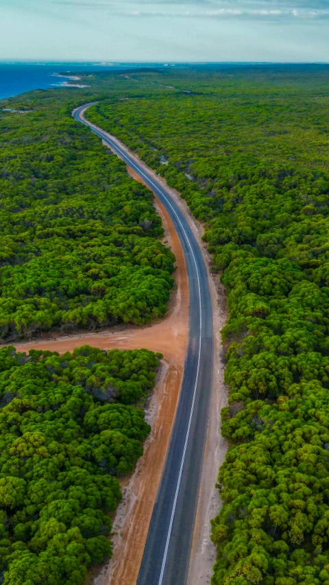 an aerial view of a deserted road in the middle of nowhere