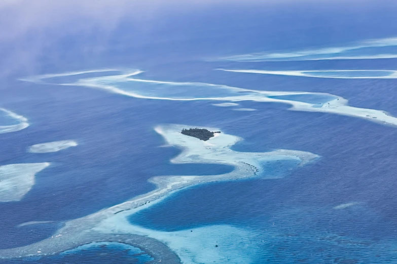 the landscape of the sea with many small islands in the distance