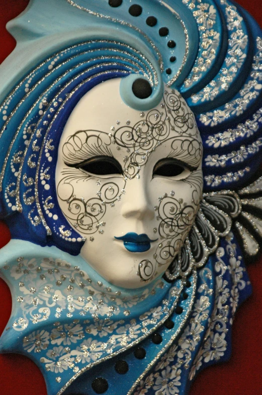 an artistic mask is displayed in blue and white