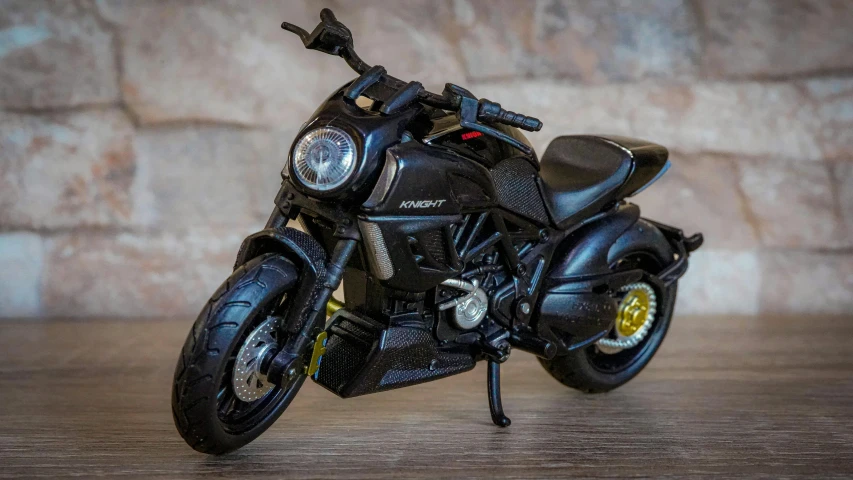 a black motorcycle with a yellow ke assembly