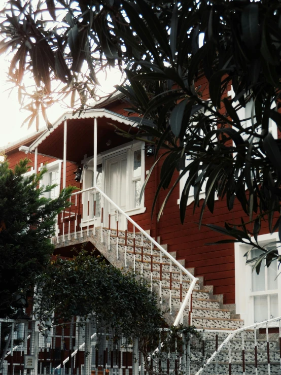 a home with large porch overlooking street in residential area