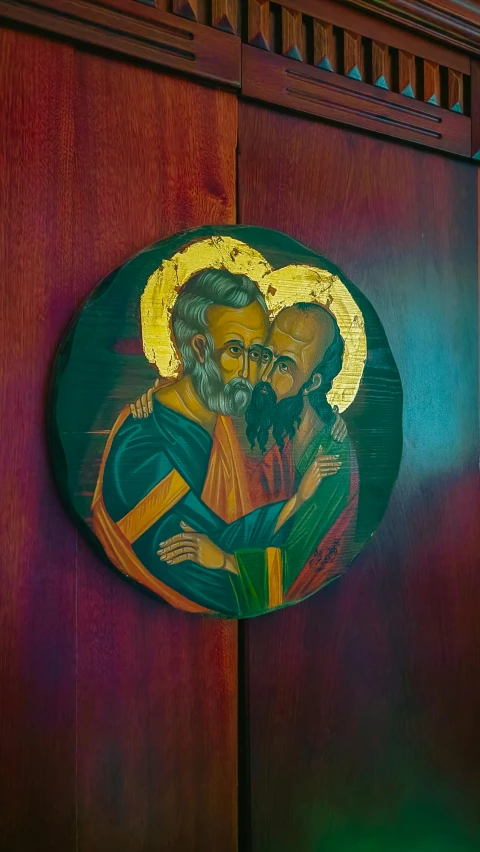 a painting of the saint joseph and christ in wooden panel
