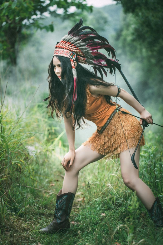 a woman posing in a headdress with a bow