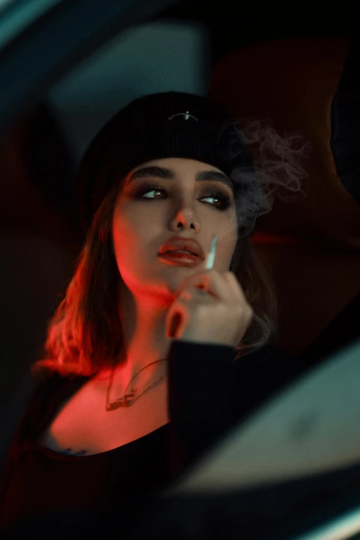 a woman smoking a cigarette in the dark