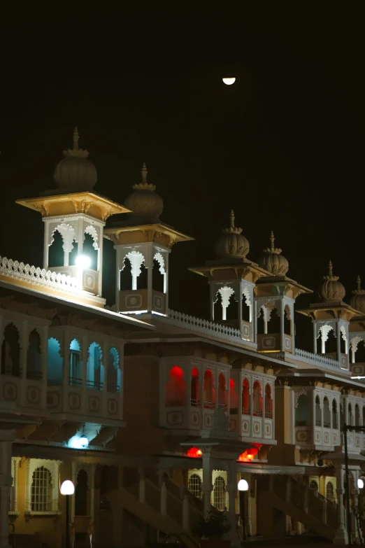 a large building with many lit up lights on top of it