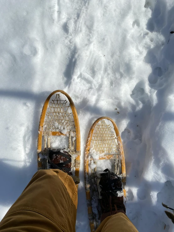 an image of someone standing on the snow with their shoes on