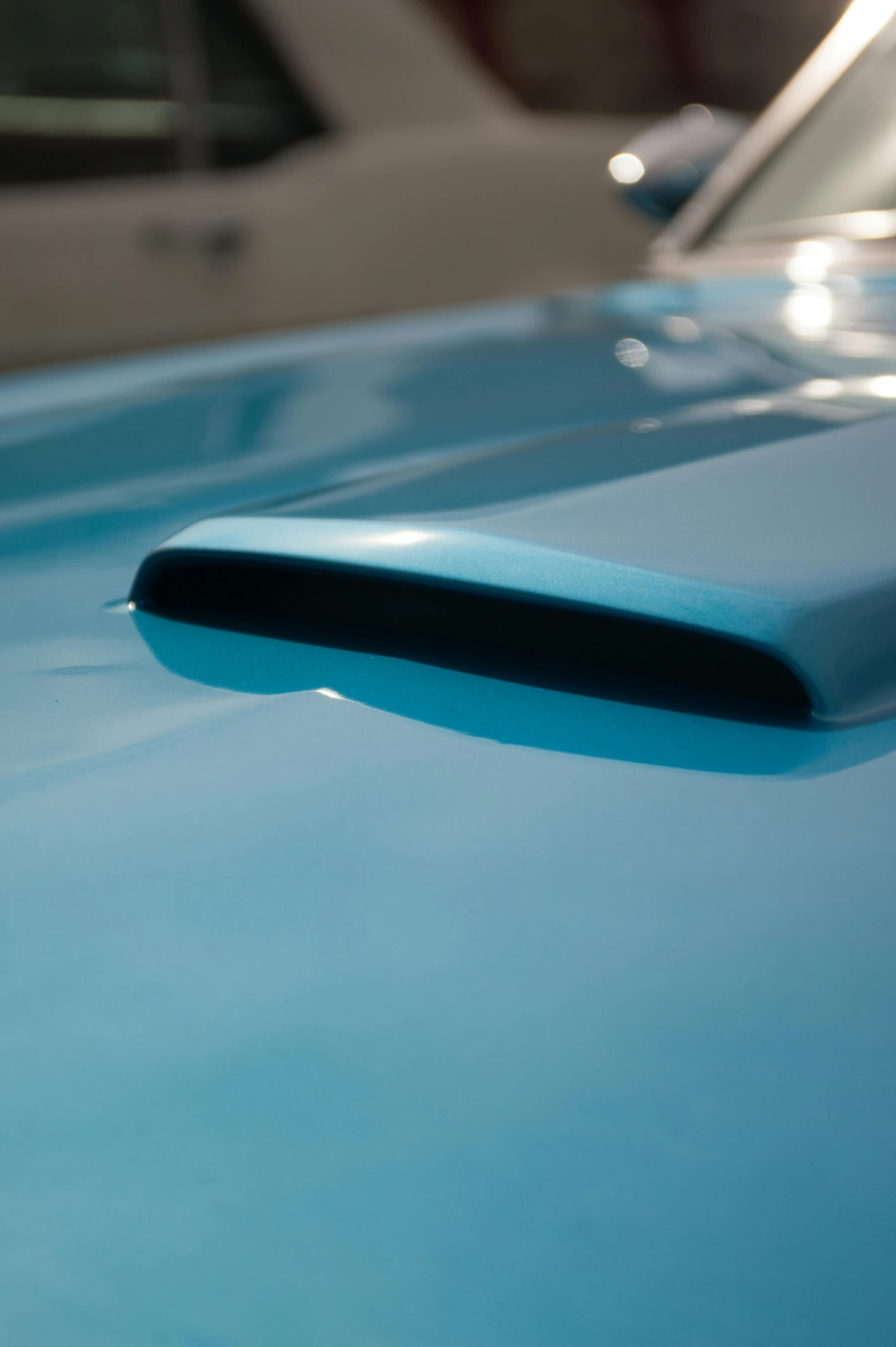 a close up view of the top of a blue car