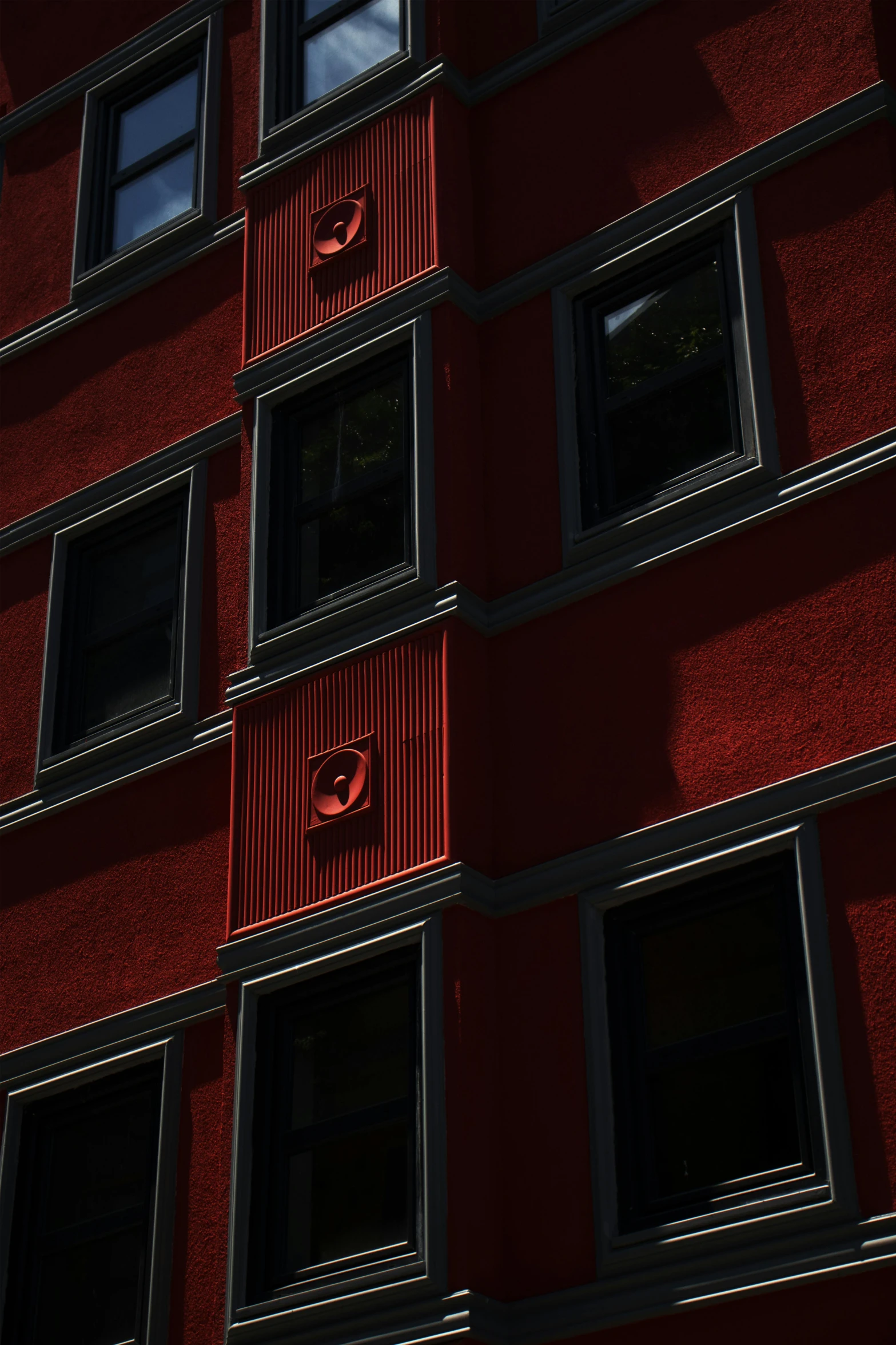 the red building has many windows to let in light