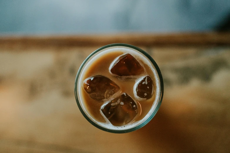 some ice in a cup sitting on a table