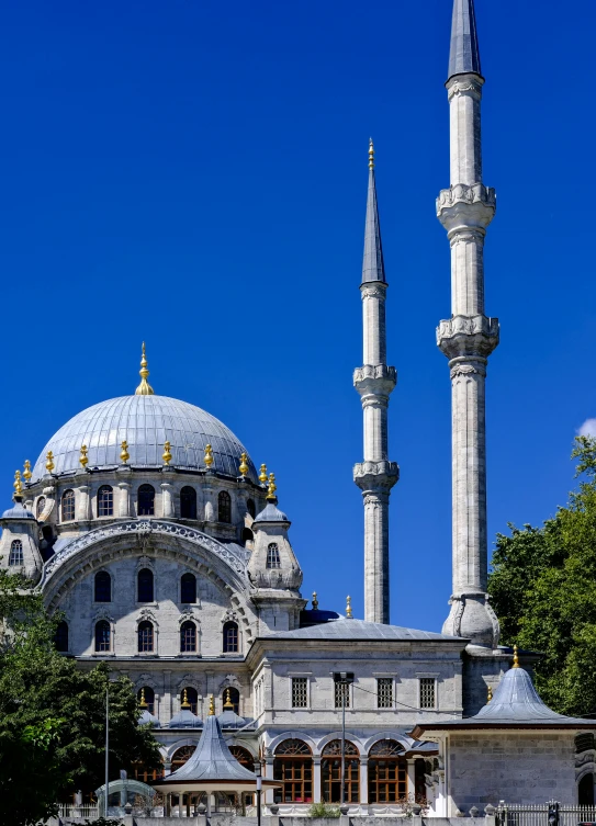 a large stone and white building with two towers