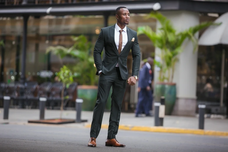 a man in suit and tie walking on the street