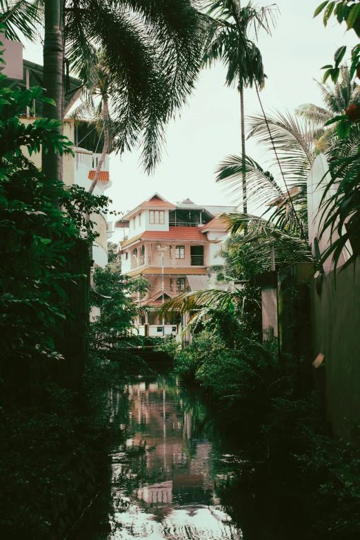 a small canal runs through an urban setting