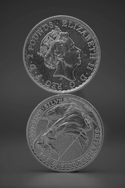 the front and back sides of a silver coin