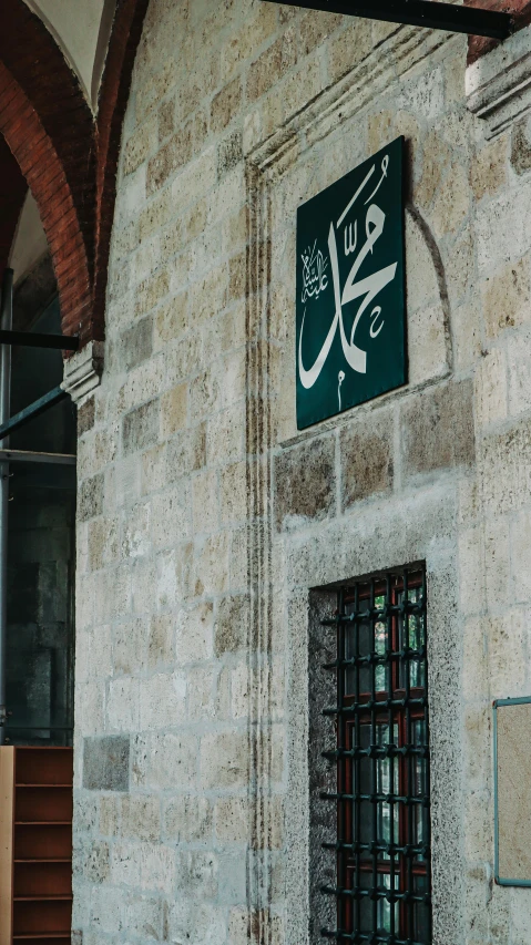 there is a sign on the side of a building that reads it is the name of a man who was murdered in the fire