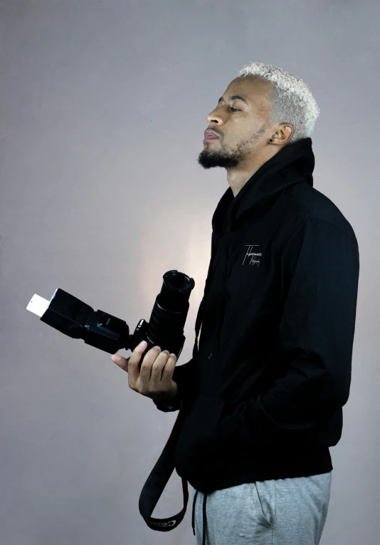 a man is holding a camera and taking a po