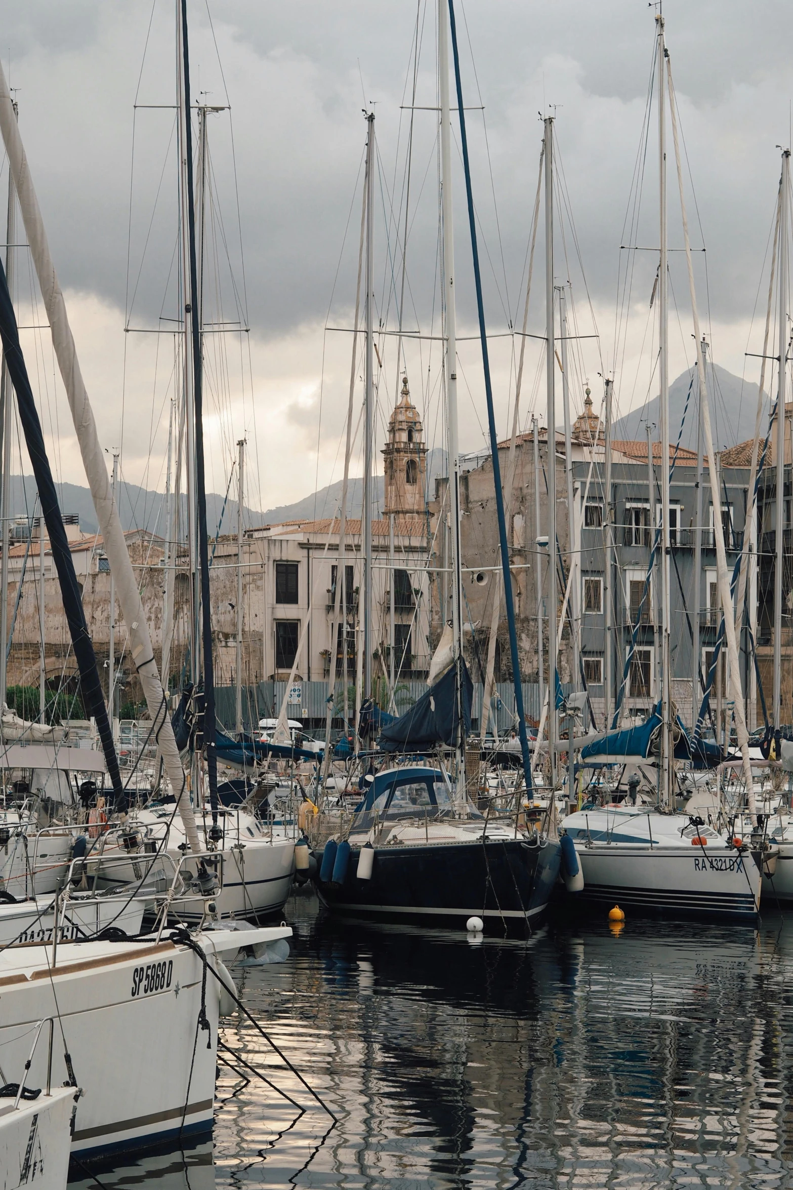 the boats are in the harbor and in the water