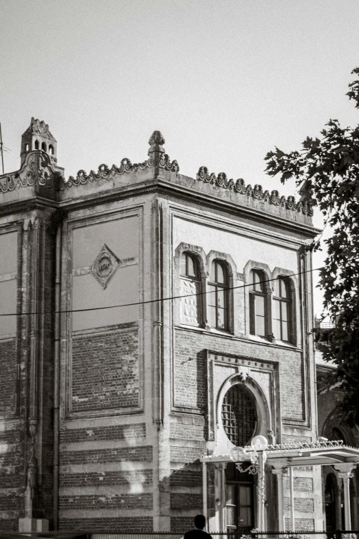 old fashioned building with a car parked outside it