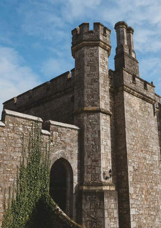 a large building with a few stone towers on top