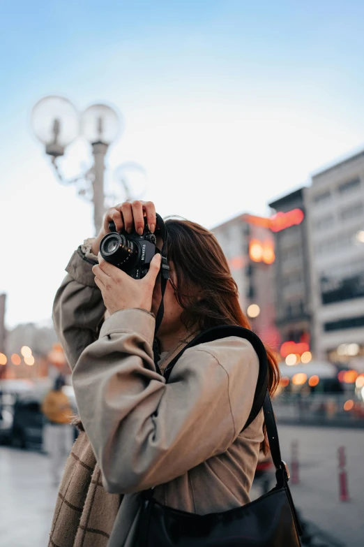 a woman takes a po of the street