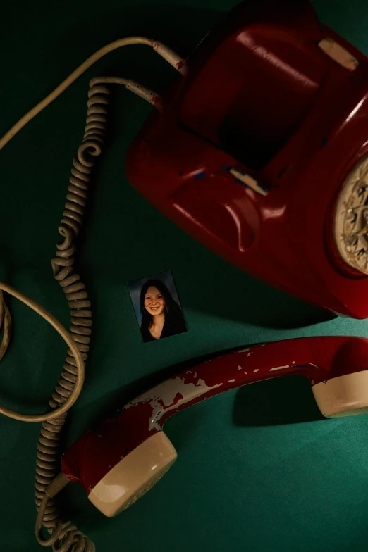 an old style red telephone and pictures are being used to promote an article