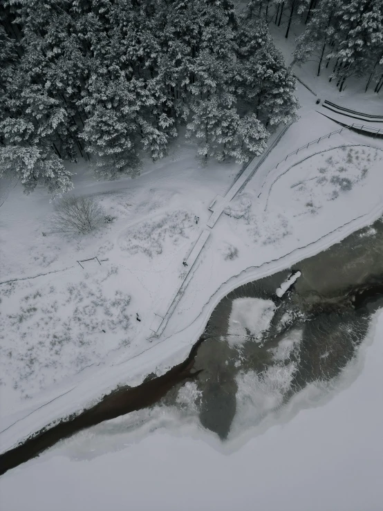 a bird - eye view of some frozen water in the snow