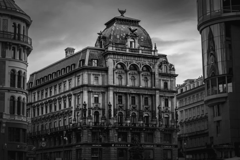 a large building in the middle of a cloudy sky