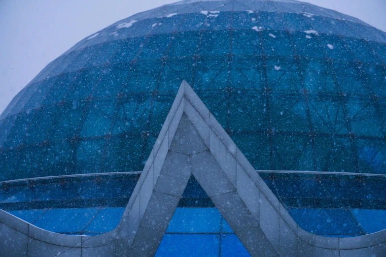 the top of a tall building with a circular design