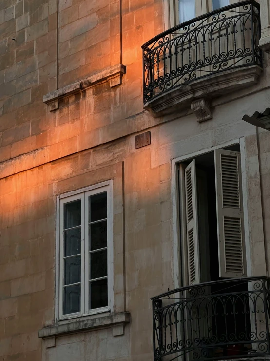 a building with some windows and balconies on it