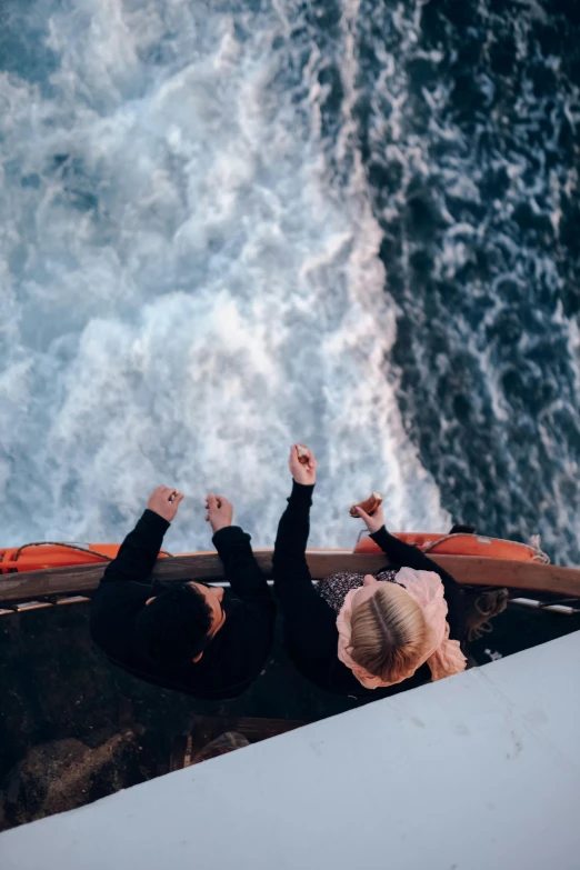 the girl is looking at the ocean waves