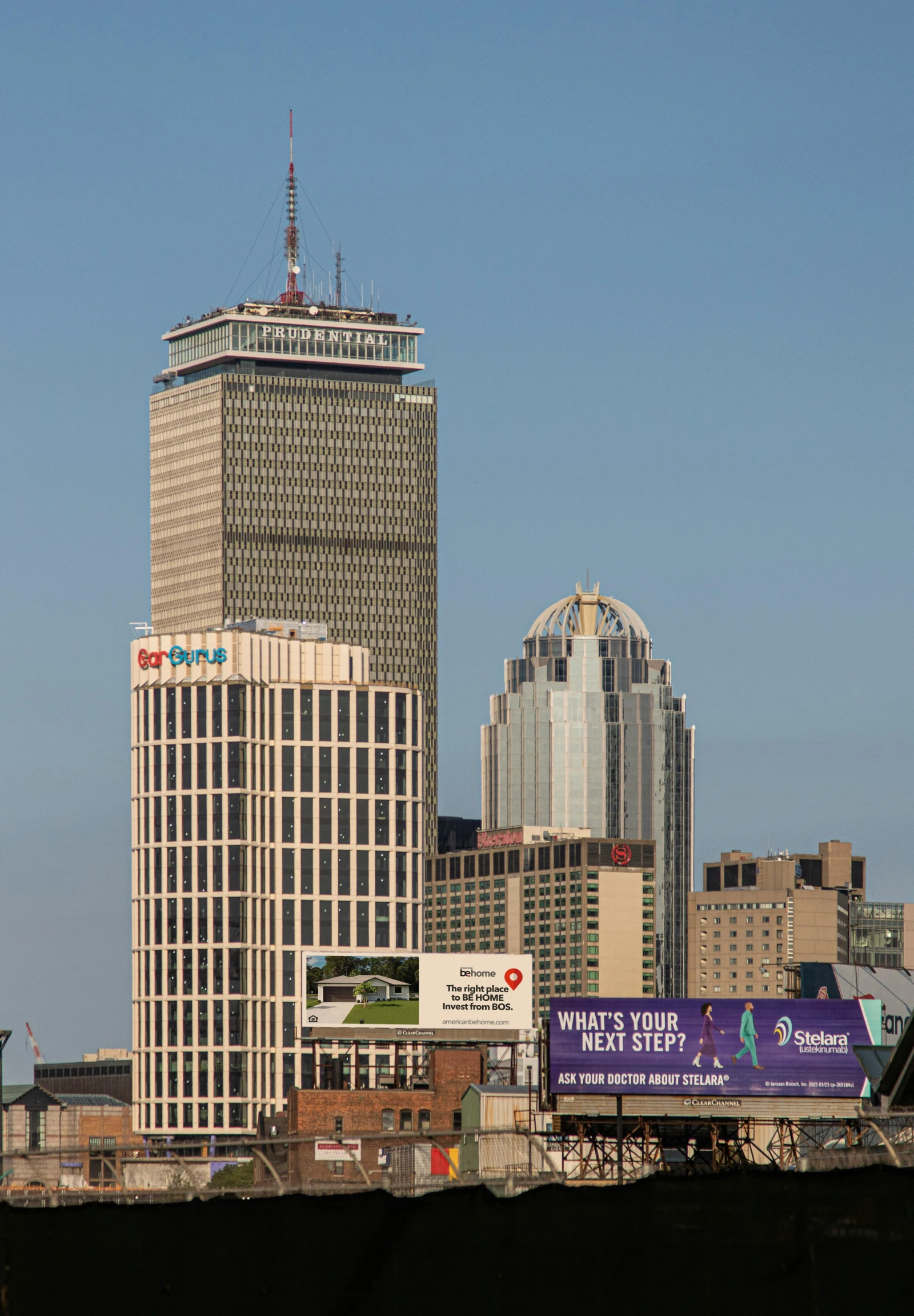 a large building stands against the skyline of skyscrs