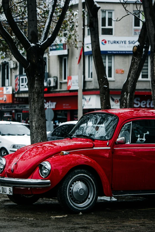 a red bug parked on the side of the road