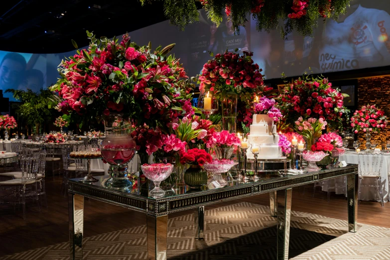 a display of many flowers on a table