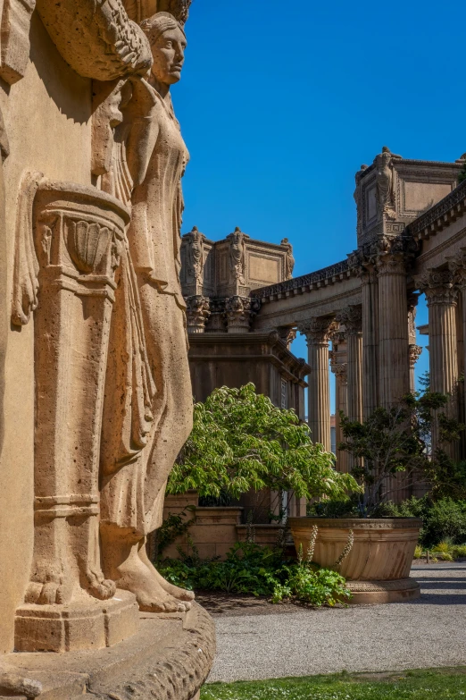 a statue outside in the middle of a garden