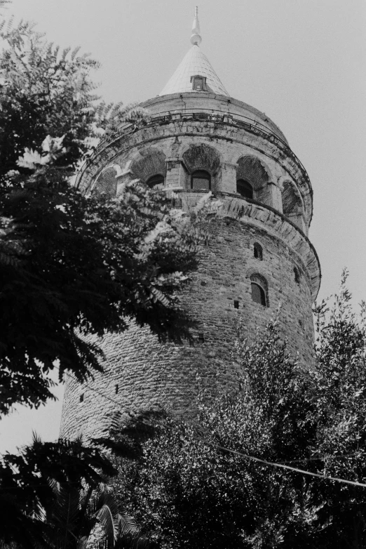 a very tall brick tower with a clock on top