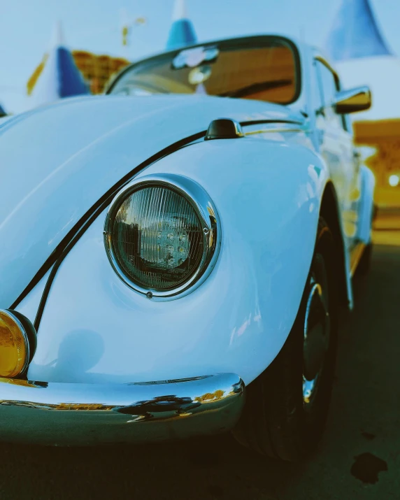 a close up of a classic sports car's hood