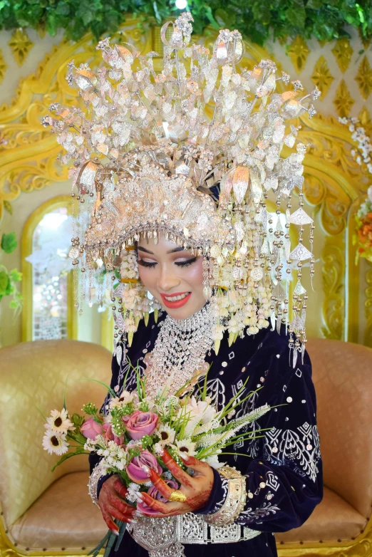 a woman is dressed as an elaborately decorated doll