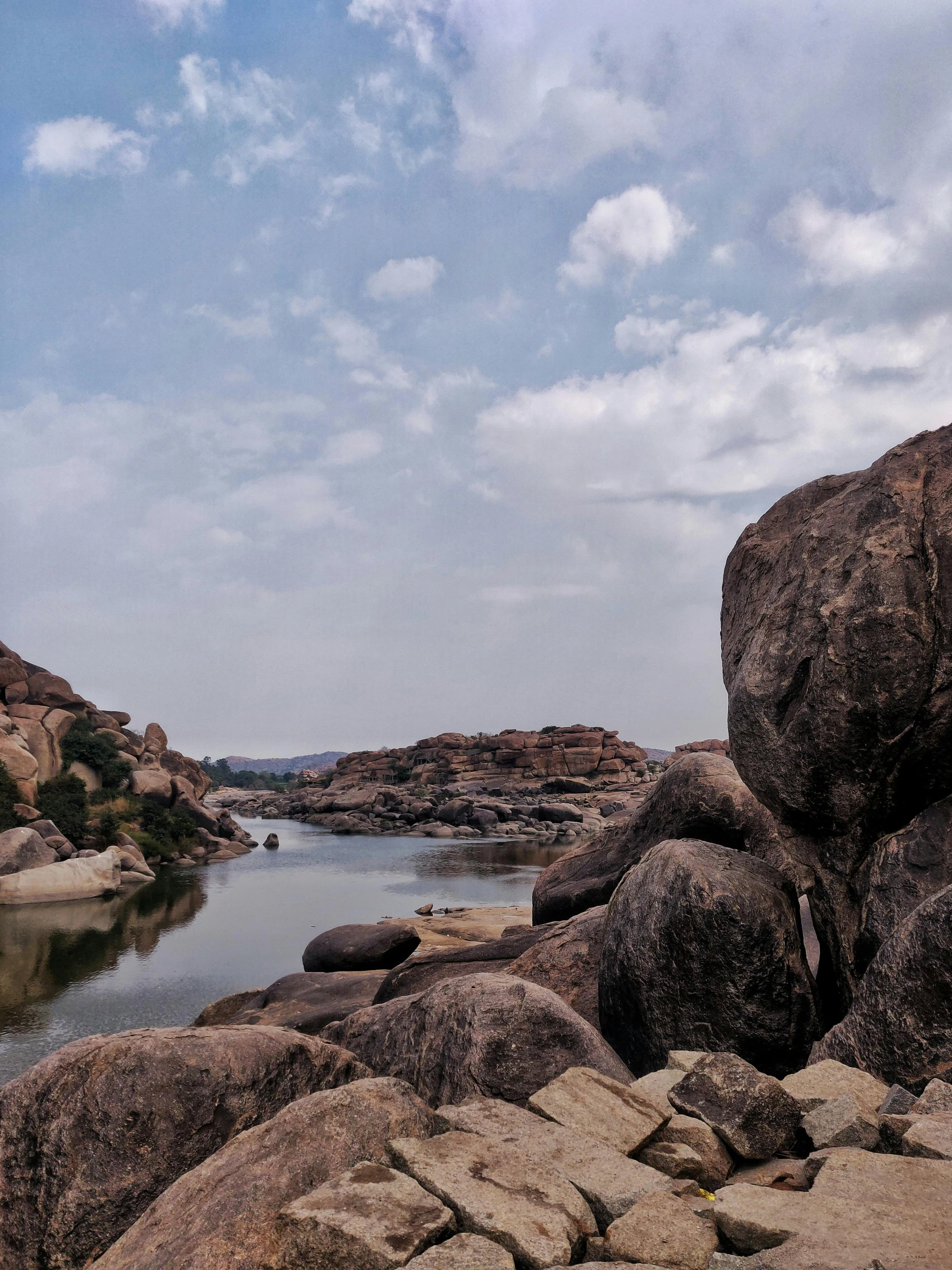 rocks covered with large chunks of rock under the blue sky