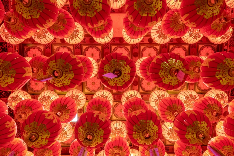 many red paper lanterns are on the ceiling
