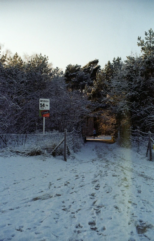 a large bus sitting on top of a snow covered field