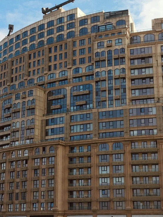 tall brown building sitting on top of a city street