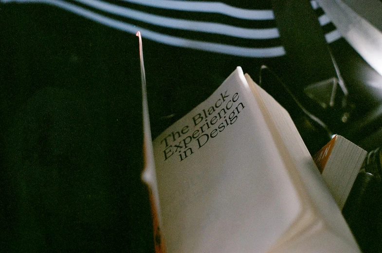 a book laying open sitting on top of a desk