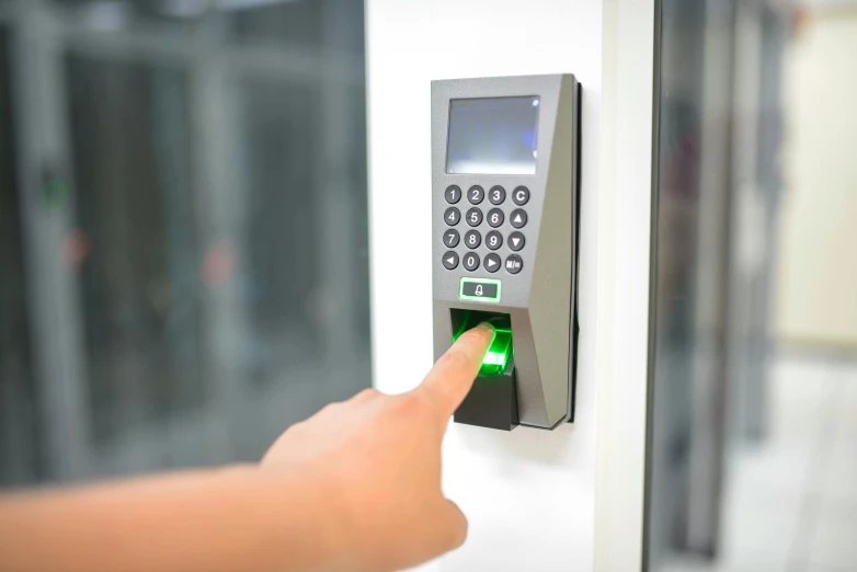 a person turning the finger on an electronic door bell