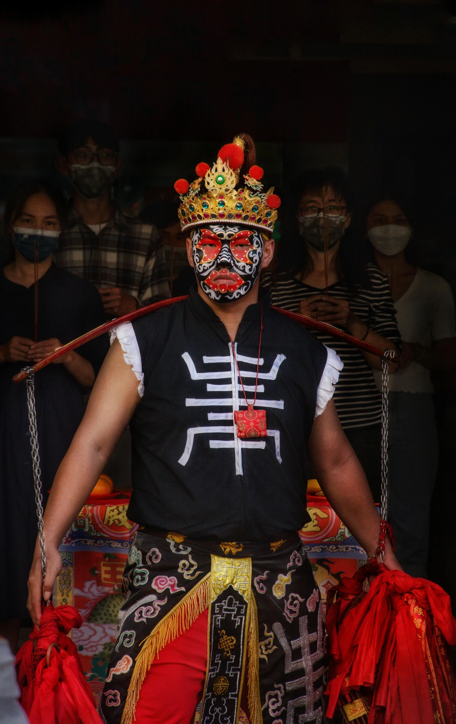 man in traditional chinese costume posing for picture