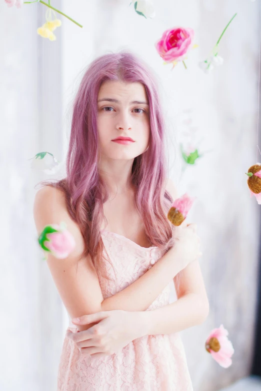 a girl with pink hair and flowers flying in the air