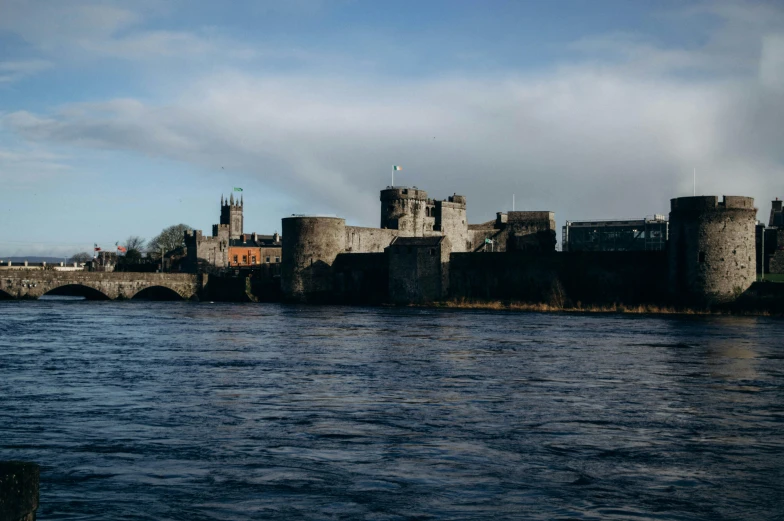 large castle type building sitting on the shore