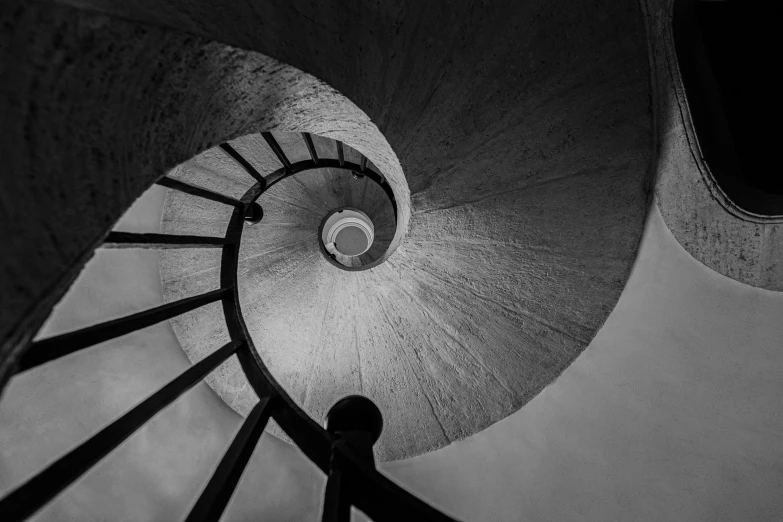 looking down at the spirally staircase in the tower